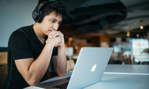 man looking at laptop screen