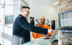 men looking at laptop