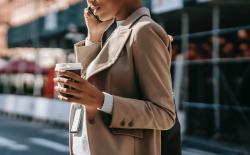 woman on phone with coffee