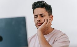 man looking at laptop